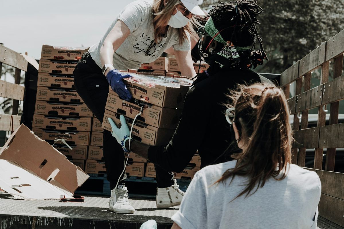 Volunteers unloading boxes of food for families in need