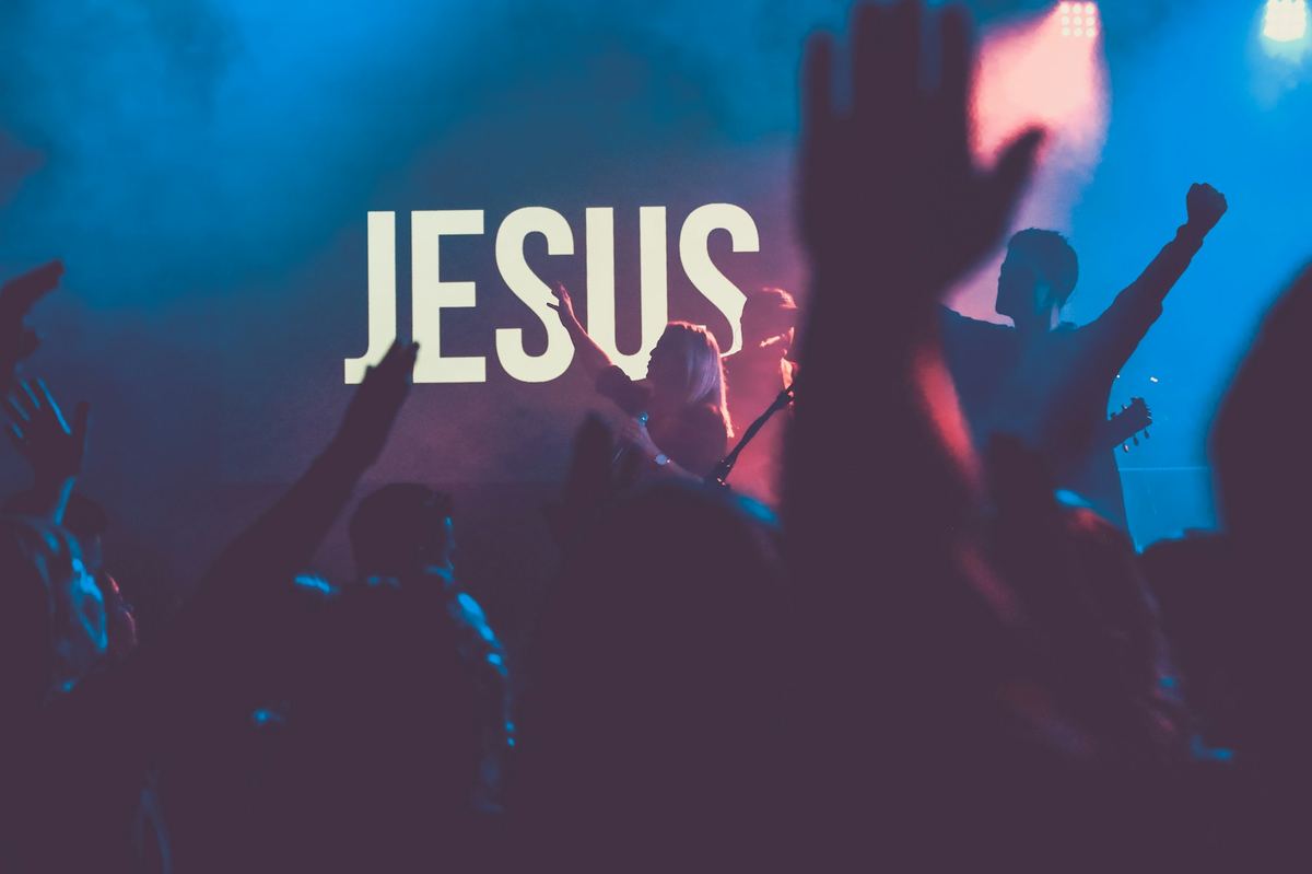 Congregation worshipping with raised hands during a Sunday service