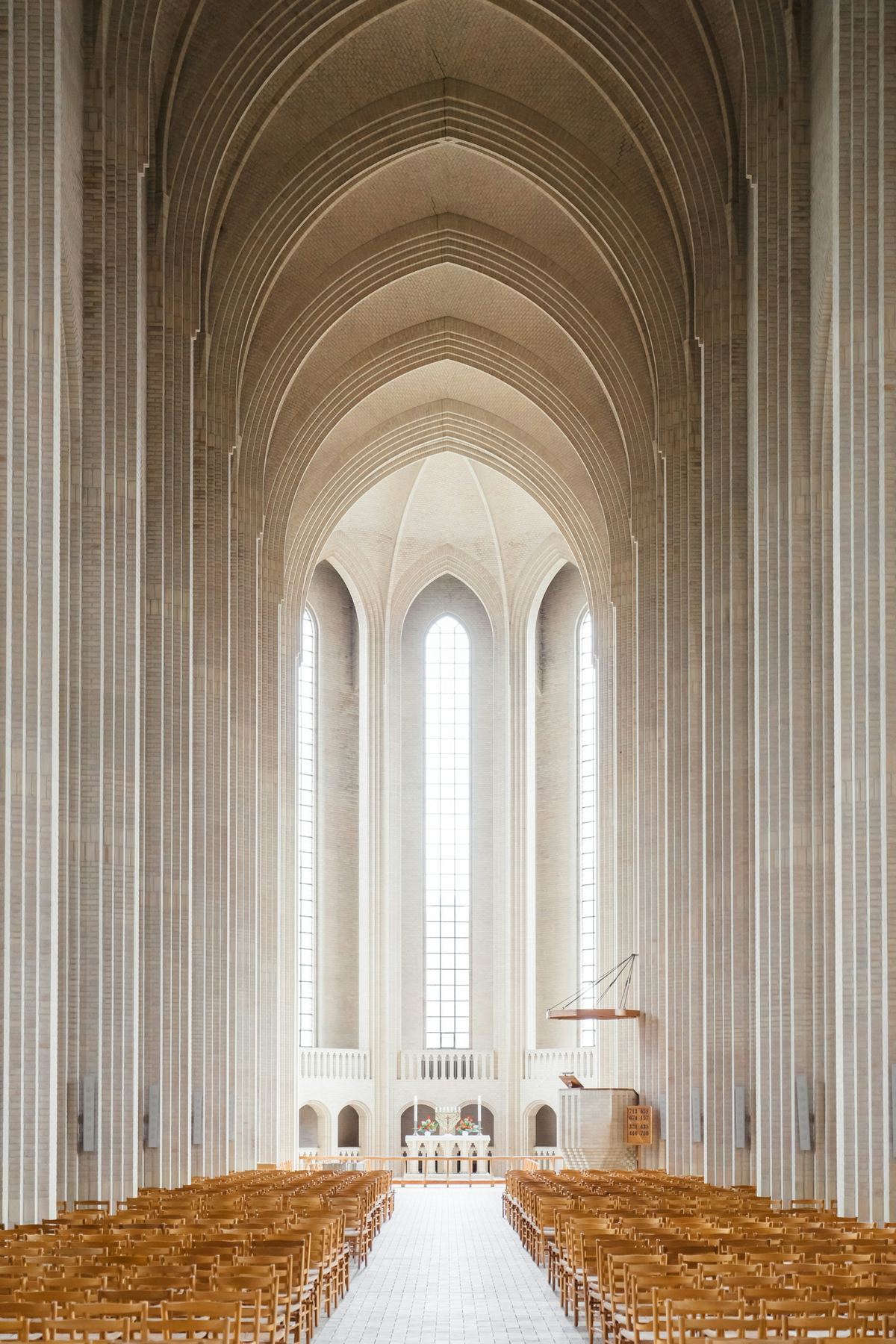 A bright, soaring church sanctuary interior filled with light